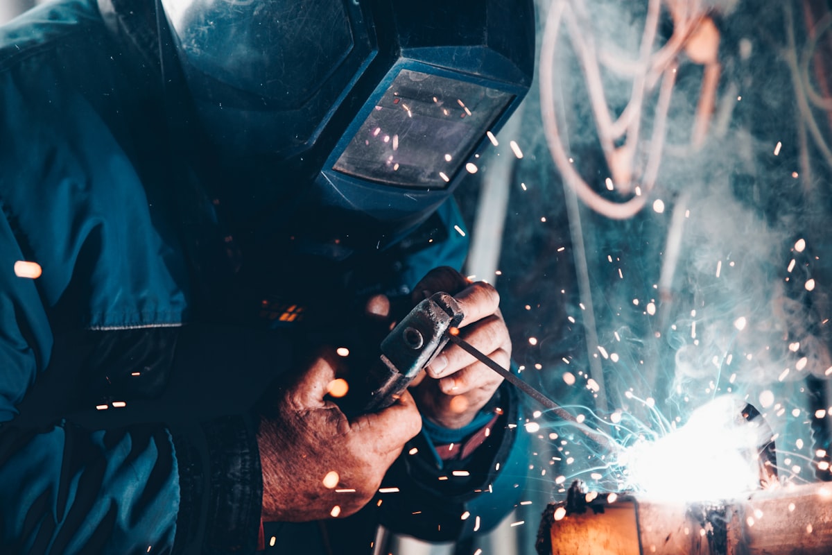Worker welding steel